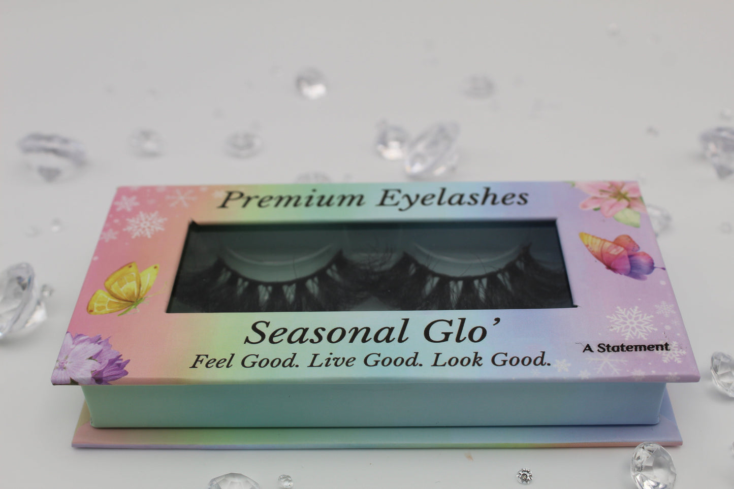 A Seasonal Glo' branded box of black trip lashes called A Statement